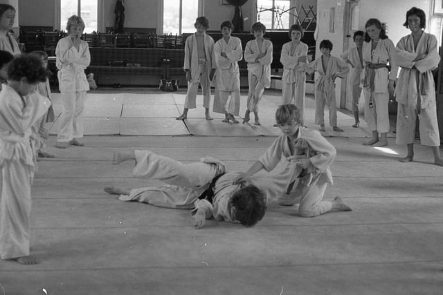The celluloid adventures of Kung Fu star Bruce Lee have aroused so much interest among Preston's youngsters, that Preston Judo Club's junior ranks have swollen considerably over the last 12 months. The Preston club have their home at the Star Ballroom in Fylde Road. Pictured: Preston Judo Club instructor Dave Quigley comes in for some heavy punishment from 13-year-old Jimmy Ross