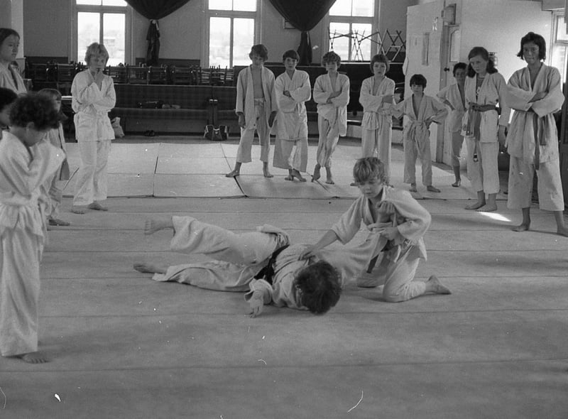 The celluloid adventures of Kung Fu star Bruce Lee have aroused so much interest among Preston's youngsters, that Preston Judo Club's junior ranks have swollen considerably over the last 12 months. The Preston club have their home at the Star Ballroom in Fylde Road. Pictured: Preston Judo Club instructor Dave Quigley comes in for some heavy punishment from 13-year-old Jimmy Ross