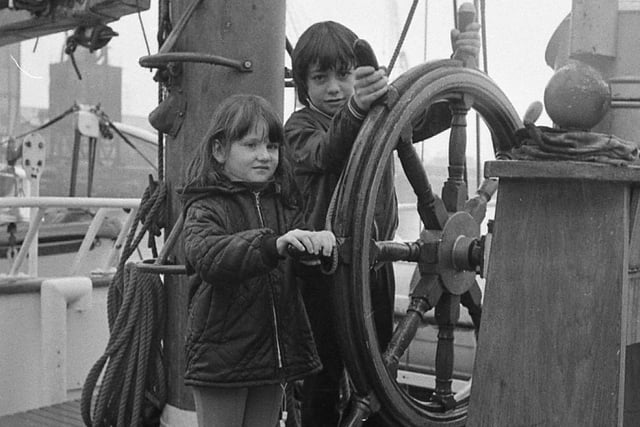 The sail training ship the Sir Winston Churchill made its first visit to Preston and was open to the public. During the stop in the port, 29 'hardened' sailors left the ship and another 39 raw recruits boarded to take their place. Pictured: Alan, nine, and Michelle Kingat, four man the wheel of the training ship