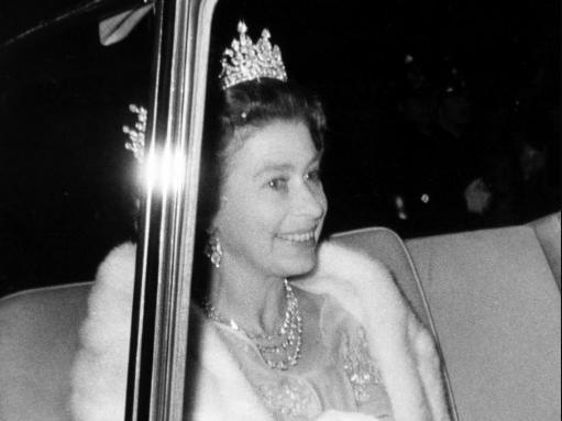 Relaxed and happy, The Queen smiles as she is driven from the Civic Hall, Leeds, to the Town Hall. 12th July 1977.