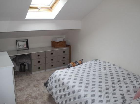 A large double bedroom having a central heating radiator and a PVCu double glazed window to the front elevation.