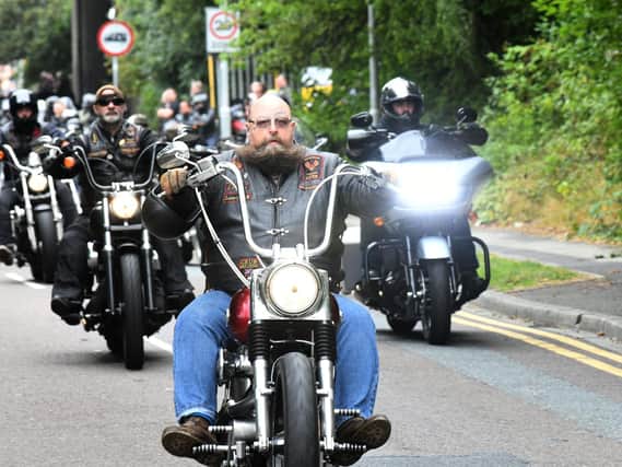 Bikers lead an emotional procession through the city on Friday in honour of the longest serving member of the 'Blue Angels Motorcycle Club' in Leeds.