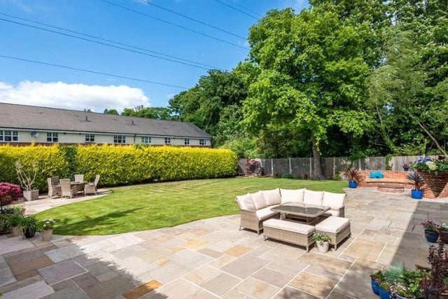The rear garden is mainly laid to lawn with a generous Indian stone patio and firepit, enjoying a high degree of privacy it is the perfect space for relaxing, entertaining or al-fresco dining.
