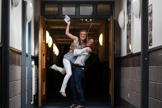 Students Jenny Telford (left) and Alex Swaby celebrate their GCSE results, at Leeds Grammar School in August 2008.