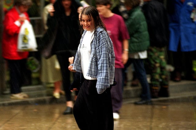 Shoppers in Leeds city centre were caught out by freak rain storms.