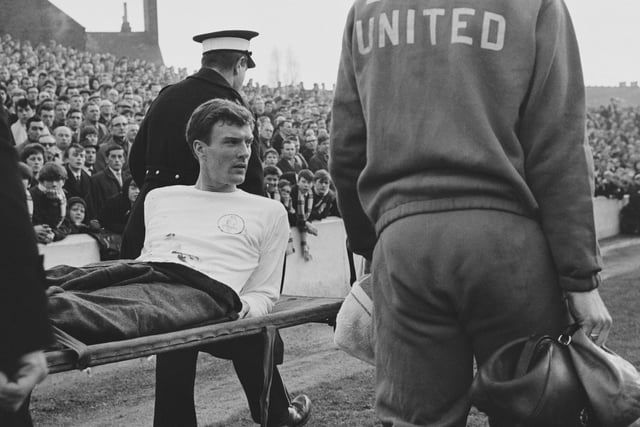 Paul Madeley is carried off after an injury during a League Division One match against Nottingham Forest in February 1966.