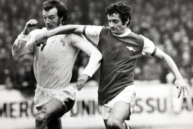 Paul Madeley and Arsenal's Frank McLintock battle for the ball.