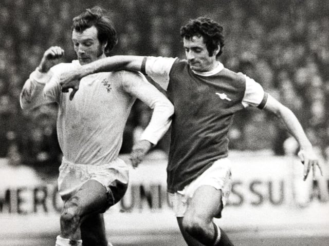 Paul Madeley and Arsenal's Frank McLintock battle for the ball.