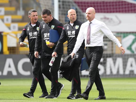 Sean Dyche, Manager of Burnley and coach Ian Woan look on prior to the Premier League match between Burnley FC and Brighton & Hove Albion at Turf Moor on July 26, 2020 in Burnley, England. (Photo by Nick Potts/Pool via Getty Images)