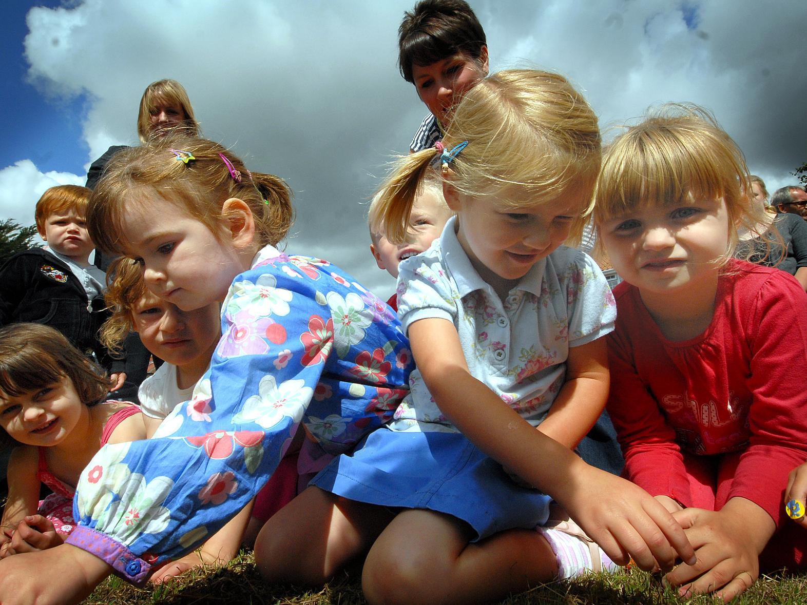 Youngsters from Seamer’s Eastgate preschool collect the pennies at the Seamer Horse Fair of 2010.