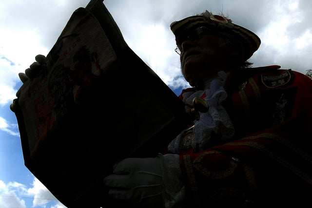 The charter is read by Town Crier Alan Booth as the sun breaks in the sky.
