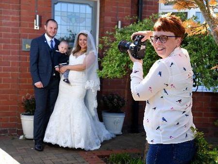 Christina Davies of Fish 2 Photography has raised over £300 by photographing families on their doorsteps during lockdown, including Ben and Bridget Mashiter in their wedding outfits with son Albert, 10 months