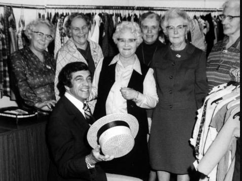 Frankie Vaughan serenading helpers at the Oxfam shop. From the left are: Mrs. Jessie Hull, Mrs. Lavinia Braid, Mrs. Jessie Sunderland Mrs. Molly Finch, Miss Kathleen Maud and Mrs. Dorothy Emsley. 27th February 1978