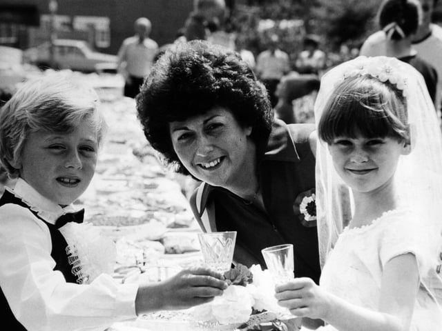 Charles and Diana, alias Antony Blore and Claire Allison, both aged eight, of Moorgate Close with Pam Blore, who made Claire's outfit from her own wedding dress.