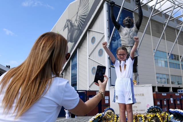 Natasha Smith takes a picture of her daughter Kasey Rothera aged 8 with the new shirt