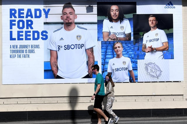 Fans walk past the 'Ready for Leeds, a new journey begins' banner