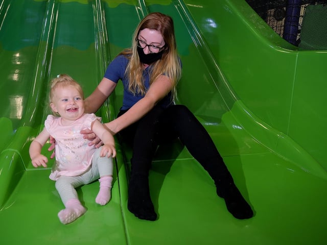 Nina Moore with mum Danielle Thorpe on the slide