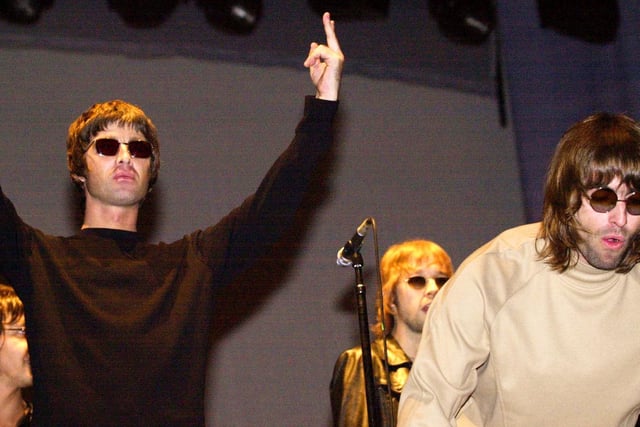 Liam and Noel Gallagher of Oasis on stage at Leeds 2000. Photo: Bruce Rollinson