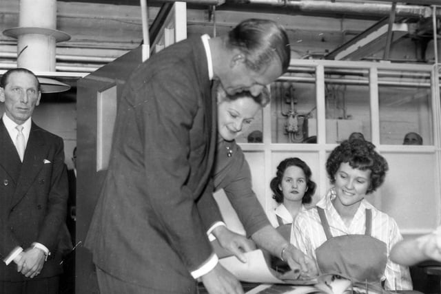 HRH The Duke of Edinburgh meets workers during a visit to the factory. He was accompanying The Queen on a two-day royal visit to Leeds in which they attended celebrations for the centenary of the Leeds Triennial Musical Festival.