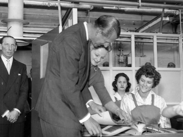HRH The Duke of Edinburgh meets workers during a visit to the factory in October 1958. He was accompanying The Queen on a two-day royal visit to Leeds in which they attended celebrations for the centenary of the Leeds Triennial Musical Festival.
