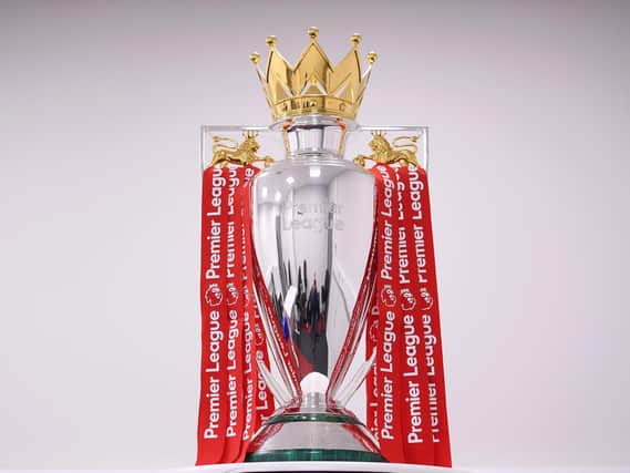 The Premier League Trophy is dressed in Liverpool Red Ribbons ready for the presentation ceremony.