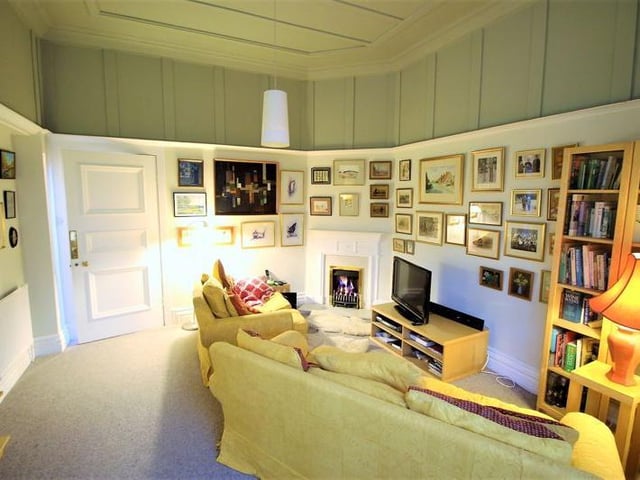 Just off the main living room is this windowed snug with a door to the rear garden.