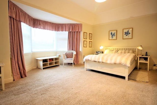 Spacious bedroom with bay window.
