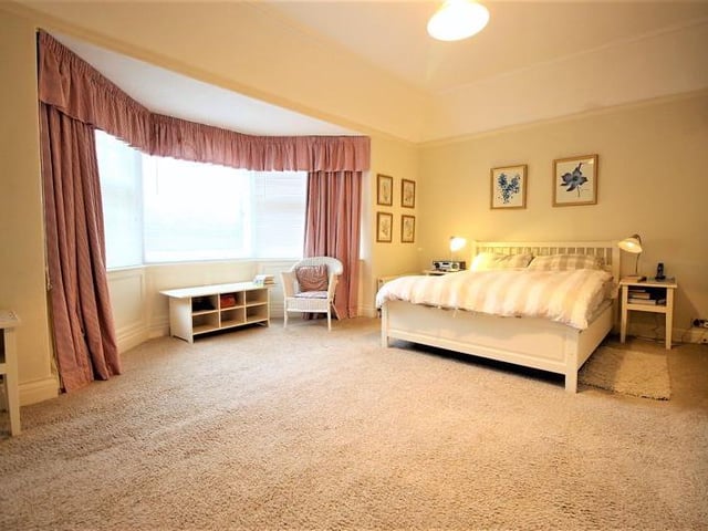 Spacious bedroom with bay window.