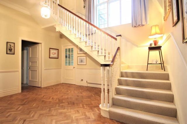 Welcoming entrance hall with doors leading to the living room and conservatory.