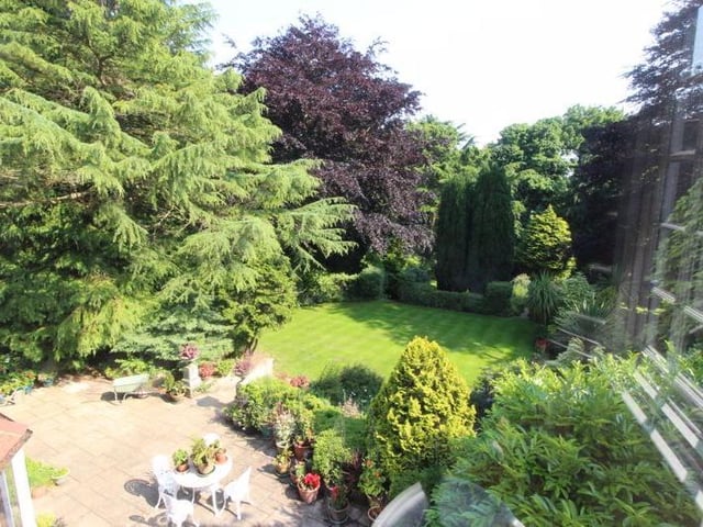 Well maintained rear garden with paved patio area.