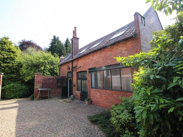 Separate annexe comprising of ground floor garage and workshop.