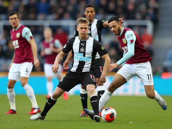 Matt Ritchie of Newcastle United is challenged by Dwight McNeil of Burnley during the Premier League match between Newcastle United and Burnley FC at St. James Park on February 29, 2020 in Newcastle upon Tyne, United Kingdom. (Photo by Alex Livesey/Getty Images)