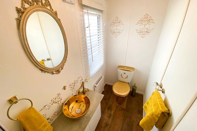 The bathroom has a "gold-plated throne" and gold accents throughout.