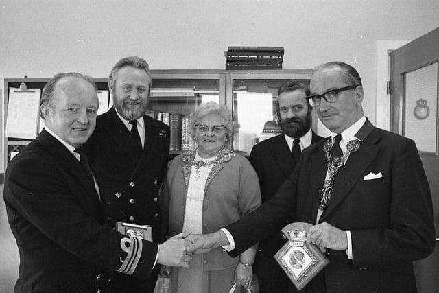 The Mayor of Preston, Coun Bob Weir, exchanges plaques with an old friend, Lt Cdr Sydney Wakeham (left), after the mayor made his first visit to HMS Inskip. The exchange presentation was watched by Fleet Chief Alan Grocott, the mayoress Mrs Jane Weir, and Regulating Officer William Bailey