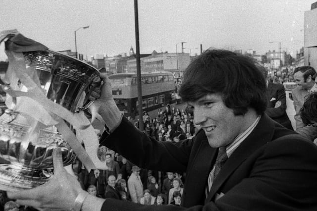 Eddie Gray shows off the FA Cup to fans during a homecoming parade after Leeds United won the 1972 final.