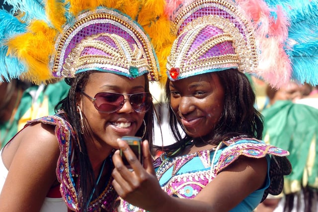 Carnival participants photograph themselves in their costumes in 2007.