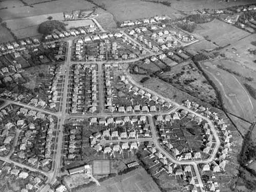 Aerial view of an estate of semi-detached housing in Alwoodley. Running vertically up on the left hand side is The Avenue, with The Valley and The Quarry leading off to the left and Meadow Way and The Fairway to the right.