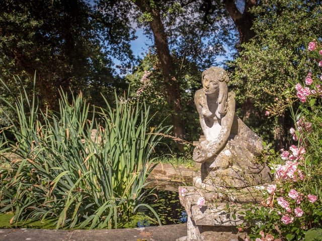 The house boasts mature gardens