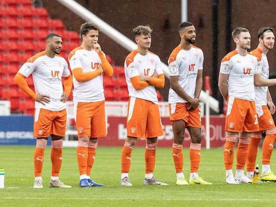 Blackpool's players watch on nervously during the penalty shootout