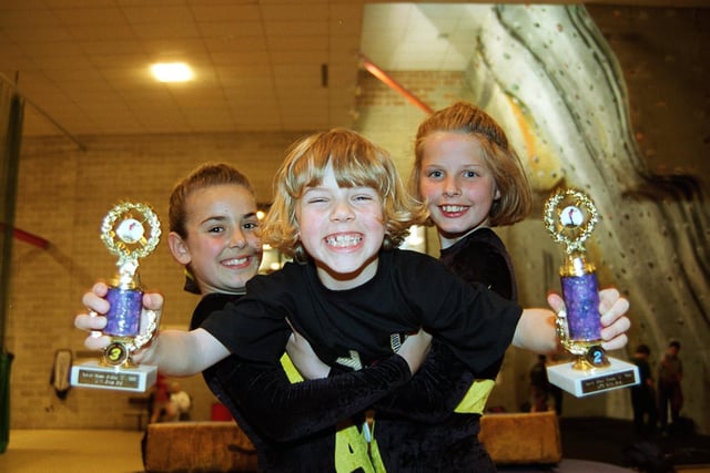 West View Trampolining Club members, from West View Leisure Centre in Preston, Kellie Tootell 9 and Laura Stephenson 11 hold Harriet Kilgallen 7 who proudly holds aloft trophies won at the North West Divisional Trampolining competition