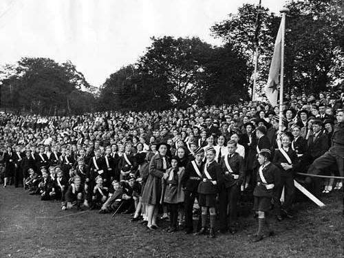 Children waiting to enter the arena for the march past in September 1942. Many of them are in uniforms of the Brownies, Guides and Boys Brigade.
