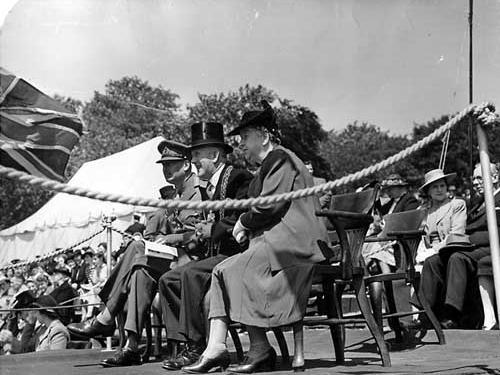 June 1944. On the left is HRH, William Duke of Gloucester, in the centre Lord Mayor Albert Hayes and Lady Mayoress Mrs Hayes. They are watching a demonstration in the arena by Leeds children