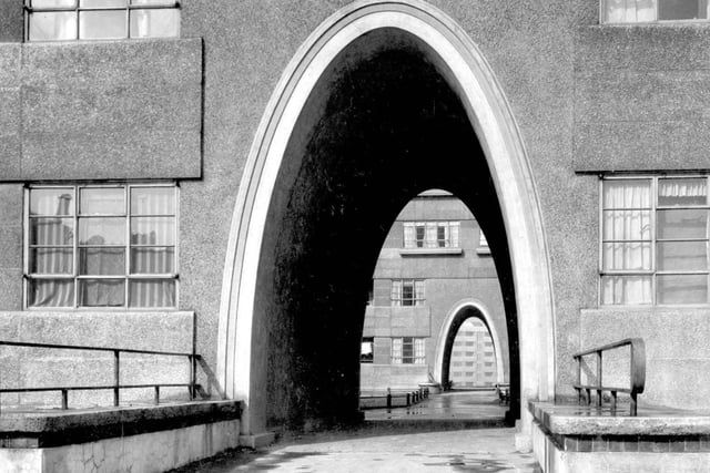A view through archway entrances into interior of Quarry Hill Flats complex. Possibly looking at Moynihan House, second archway York House, with Thoresby House at the other side.
