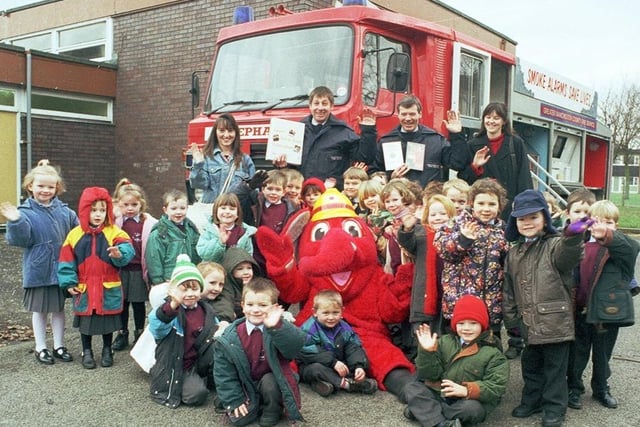 RETRO 1996 - Wigan's firefighters visit St Jude's RC primary school with mascot Welephant in 1996