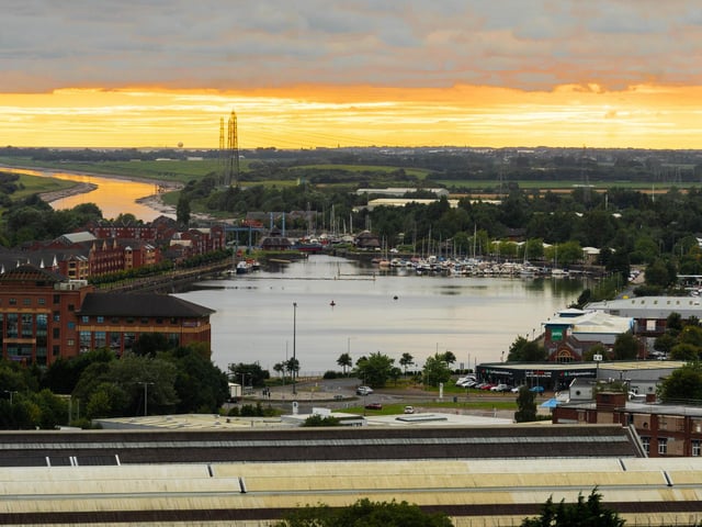 The sun sets over Preston Docklands.