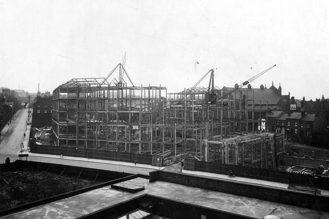 A view of Civic Hall during construction with steel girder frame visible, St. James Street can be seen on the left with Portland Crescent on the right.