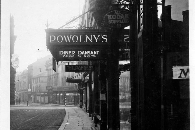Looking down Bond Street towards the junction with Commercial Street and Albion Street. In the immediate foreground is Powolny's restaurant and in the background is Woods and Baxter Fancy Draper.