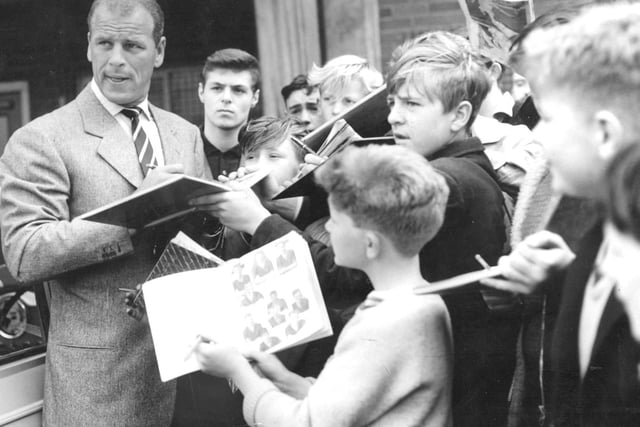 John Charles signs autographs for fans on his arrival in Leeds in July 1962. It was his second spell with Leeds United.