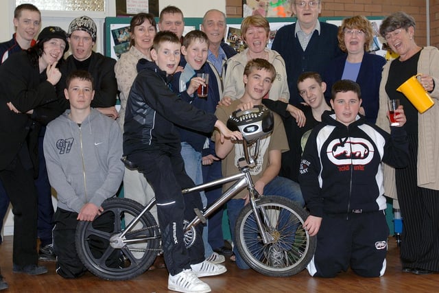 Board members and volunteers at a party to mark the end of the SRB6 (Single Regeneration Budget) project funding at Norley Hall Community Centre with youngsters who have benefitted from courses such as Cycling Solutions and Compulsory Basic Training (CBT) for motorbike riding in 2007