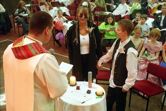 The Rev Andy Braunston conducts the blessing of the relationship between Linzi Carrington (right) and Xaviea Carrington at the Plaza Club in Leeds.